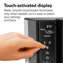 Coffee maker touch-activated display panel with highlighted options and visible time readout