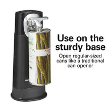 Black can opener with chrome arm holding a can for cutting