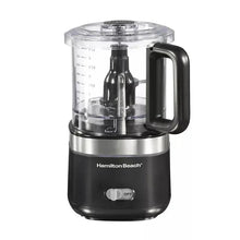 Cordless food chopper with clear container, black handle, and stainless blade assembly