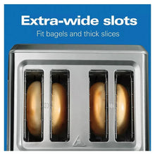 Extra-wide toasting slots with four bread slices in a stainless toaster