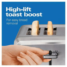 Stainless toaster with high-lift toast and hand adjusting the lever