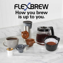FlexBrew Trio coffee maker with pods, carafe, and mug on countertop