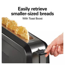 Long-slot toaster with small bread pieces and lever being pressed