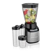 Blender base with clear large jar and three accessory jars with black lids