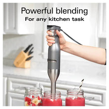 Stainless steel hand blender blending ingredients in jars