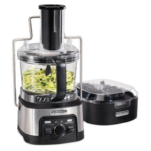12-cup food processor with clear bowl holding green vegetables and separate accessory lid