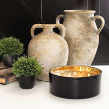 Luxury 5-wick candle in a black round jar, five flames burning