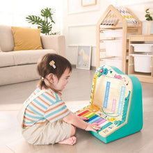 Teal pixel piano arcade toy with rainbow keys and blue grid window