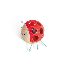 Ladybug baby rattle, side view: red shell with yellow base and blue arms