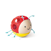 Ladybug baby rattle with red plastic body, yellow base, and blue bead arms