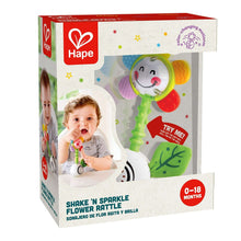 Light-up flower rattle retail box, green and red toy details, 0–18 months label