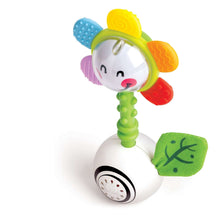 Light-up flower rattle with smiling face, green handle, colorful textured petals and leaf