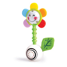 Flower light-up rattle toy with smiling face, green base ball and textured petal arms