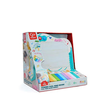 Children's pixel piano arcade toy with teal base, colorful light-up grid and keys