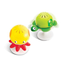 Two animal stay-put rattles: green turtle and yellow octopus on suction bases