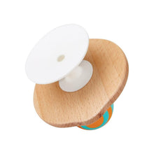 Wooden base stay-put rattle with white circular top and small center hole