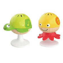 Green turtle and yellow octopus stay-put rattles with suction bases