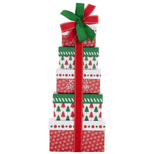 Holiday sweets gift tower: red and white patterned boxes tied with red ribbon and green bow