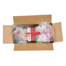 Open shipping box holding wrapped holiday sweets, showing red and green patterned gift packs