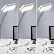 Set of white light therapy desk lamps on a tabletop, arched heads and round bases