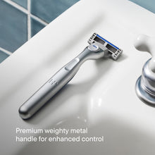 Weighted metal shaving razor handle with blue blade cartridge