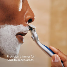 Shaving razor using precision trimmer near beard area