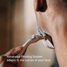 Shaving razor shaving facial hair with pivoting 5-blade head