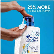Hands using a pump to dispense shampoo from a white bottle with blue pump