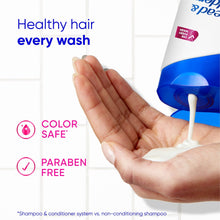 Hand with foam beside Head & Shoulders Smooth & Silky shampoo bottle