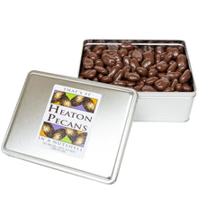 Chocolate-covered pecans in metal tin with lid label