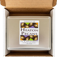 Chocolate-covered pecans tin in cardboard box, lid label visible