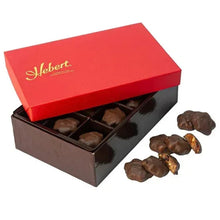 Milk chocolate caramel gift box with cranberry and cashew pieces on side