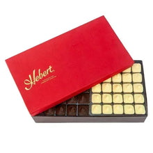 Hebert chocolate assortment gift box open showing milk and white chocolate rows