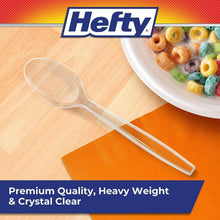 Clear plastic spoon with shallow oval bowl and straight handle