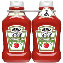 Two Heinz Organic tomato ketchup bottles, front labels shown, white caps.