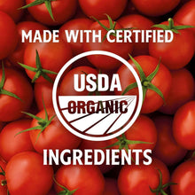 Organic tomato ingredients label with USDA organic seal, on tomato backdrop.