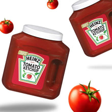 Heinz tomato ketchup bottles with white caps and red labels, with tomatoes