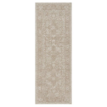 Rectangular beige area rug with tone-on-tone ornate medallion pattern.