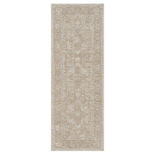 Beige rectangular area rug with ornate distressed medallion pattern, flat weave