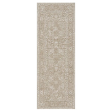 Beige area rug rectangle with repeating ornate motifs and distressed background
