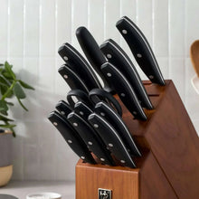 Henckels knife block set with multiple black knives standing in wooden block