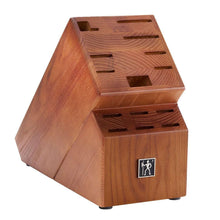 Wooden knife block with Henckels logo plate and open slots for knives