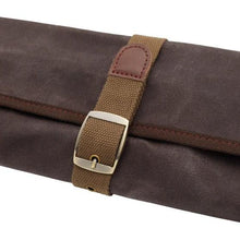 Brown canvas roll with tan webbing strap and metal buckle closure