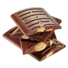 Milk chocolate pieces with visible whole almonds