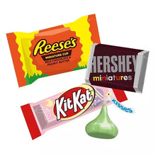 Assorted wrapped chocolates: Reese's cup, Kit Kat, Hershey's miniatures, Hershey's Kisses