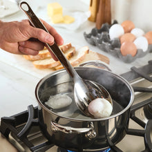 Hestan Provisions slotted spoon lifting ice cubes from pot
