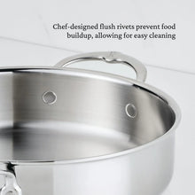 Stainless steel rondeau pot side showing flush rivets and rivet holes