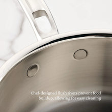 Stainless steel butter warmer close-up of smooth rivets on the side