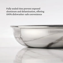 Stainless steel skillet with fully sealed polished rim and sidewall