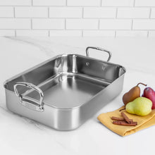 Stainless steel roasting pan with built-in wire rack, wide interior and side handles